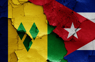flags of St Vincent and the Grenadines and Cuba painted on cracked wall