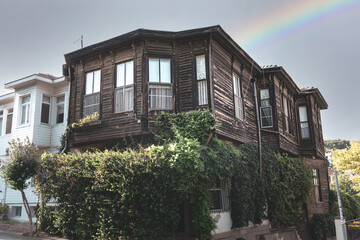 Ancient home under white sky with rainbow in Heybeliada, Prince Islands, Istanbul. Old style photo...