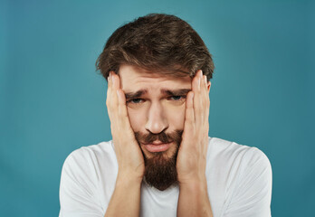 Man in a white t-shirt irritated facial expression Studio