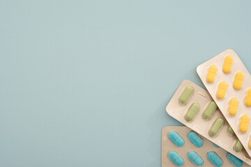 Close-up Detail Photo Pharmacy Medicine Blue, Green, yellow Pills On Blue Background