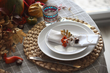 Festive autumn table setting with pumpkin