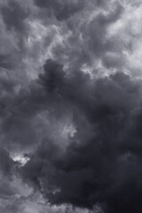 Storm sky with dark gray black epic clouds background texture, hurricane with thunderstorm, cyclone. Black and white
