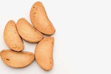 Breadcrumbs on a white plate. Rusks on a white background. Vanilla rusks.