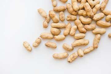 Peanuts in shells on a white background. Nuts on a white background.