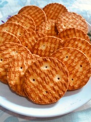 A plate of crispy White Biscuits.