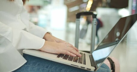 Close up of asian women using computer laptop at the airport