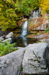 Fototapeta na wymiar waterfall in a river with water, autumn nature