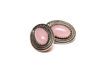 Silver earrings with rose quartz isolated on the white background.