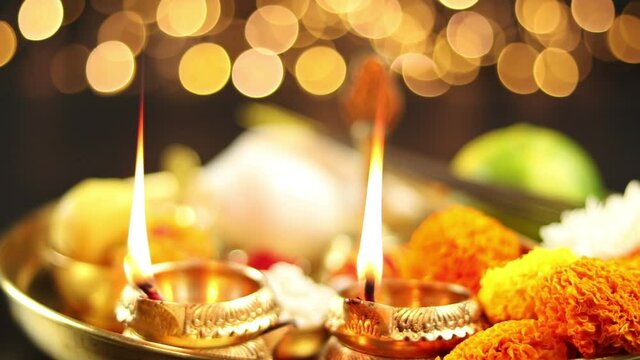 Illuminated Metal Brass Lamp Called Diya Deep Or Dia Glowing With Bokeh. Theme For Diwali, Navratri, Dussehra Puja, New Year, Deepawali, Karva Chauth, Teej, Ganesh Chaturthi Or Shubh Deepavali Pooja