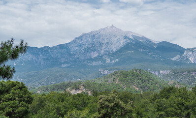 Mountain Tahtali Dagi, also known as Lycian Olympus among forests. Spring landscape. Turkey.
