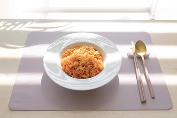 Kimchi fried rice with a spoon.