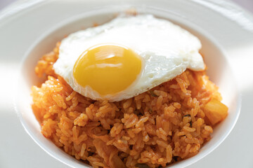 Kimchi fried rice with fried eggs.
