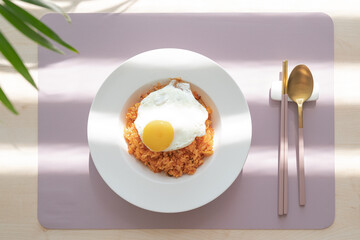 Kimchi fried rice with fried eggs.