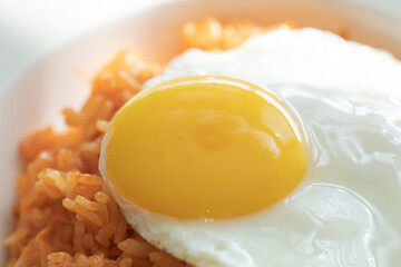 Kimchi fried rice with fried eggs.