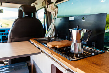 Aqua bialetti coffee maker on a camper van hob, in a T4 camper van