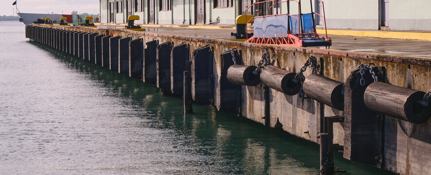 Rubber fenders protect the vessel and the pier by absorbing the impact from the vessel during its docking and undocking maneuvers.
