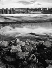 Water dam and power plant in long exposure black an white - obrazy, fototapety, plakaty
