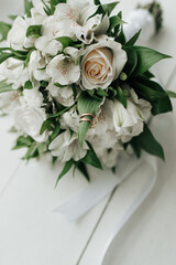 wedding rings lie on the wedding bouquet morning bride wedding details