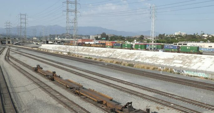 Tilt shot up the train tracks in the railroad yards in downtown Los Angeles
