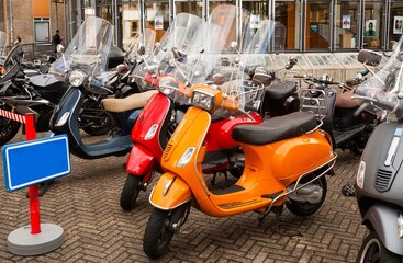 Colored Scooters on the city street road