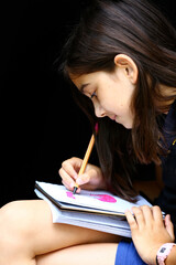 girl drawing as home work
