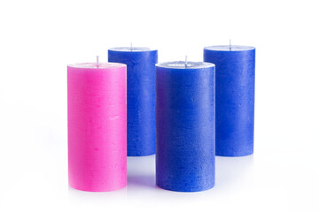 Christmas candles on a white background. Pink and blue candles