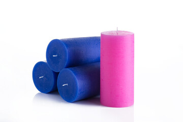 Christmas candles on a white background. Pink and blue candles