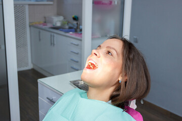 Examination oral cavity or treatment teeth, visiting dental office