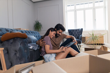 Happy embraced couple enjoying in their memories at the new apartment.