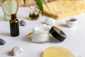 Fototapeta na wymiar Care hemp cosmetics on the white table 