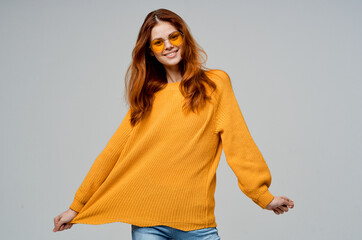 beautiful woman in yellow glasses posing fun lifestyle light background