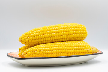 Boiled corn on a white background