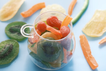Dried fruits and berries on blue background 