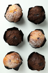 Chocolate muffins on white background, top view