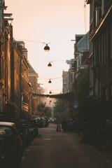 Narrow old street at dusk with warm light © joangasconcomas