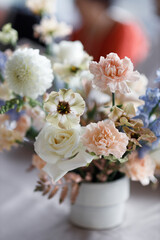 Wedding decor on the table decoration. A bouquet of white flowers, a composition with candles.