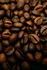 fresh roasted coffee beans as a background. a lot of coffee beans. macro photo of coffee beans