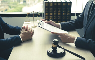 Male lawyers or a judge counseling clients about judicial justice and prosecution with scales,...