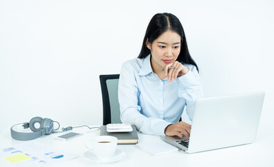 Working Asian women feel stressed, dismal tired from work, migraine headaches from hard work while working at the office