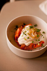 Sweet potato and steamed pumpkin with sauce in the Sweet potato and steamed pumpkin with creamy sauce in the bowl at the restaurant