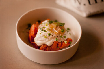 Sweet potato and steamed pumpkin with creamy sauce in the bowl at the restaurant