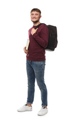 Young student with backpack and books on white background