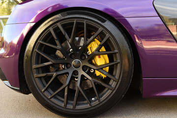 Alloy wheel with calipers and racing brakes of the sport car. Racing brake disc and low profile...