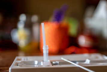 selective focus on swab of an at home rapid Covid test kit