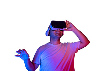 Young man using virtual reality glasses isolated getting happy.