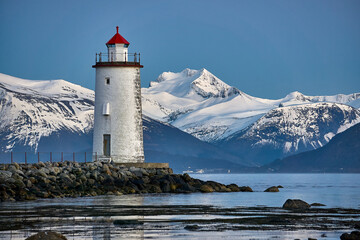 Høgstein lighthouse watching over the Sunnmøre alps, Godøy, Norway