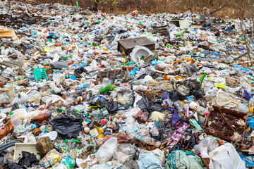 Obraz premium Verkhnie-Sergi, Russia - May 02, 2021. household waste, landfill. unauthorized dump on the field