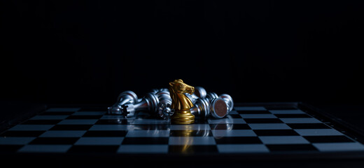 Chess board game knight gold team is winner silver team stategy game as business challange...