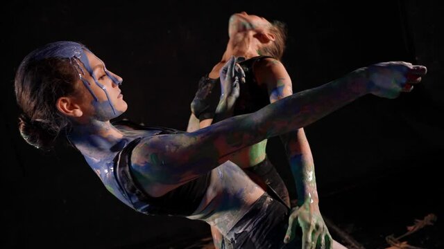 Two women in a state of trance karski on the body performance improvised art dance