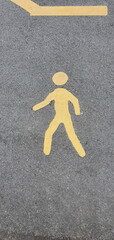 Symbol pedestrian image on asphalt road or concrete road background. This means that it is an area designated for pedestrian use only. Vehicles are forbidden to use. (road sign pedestrian)  
